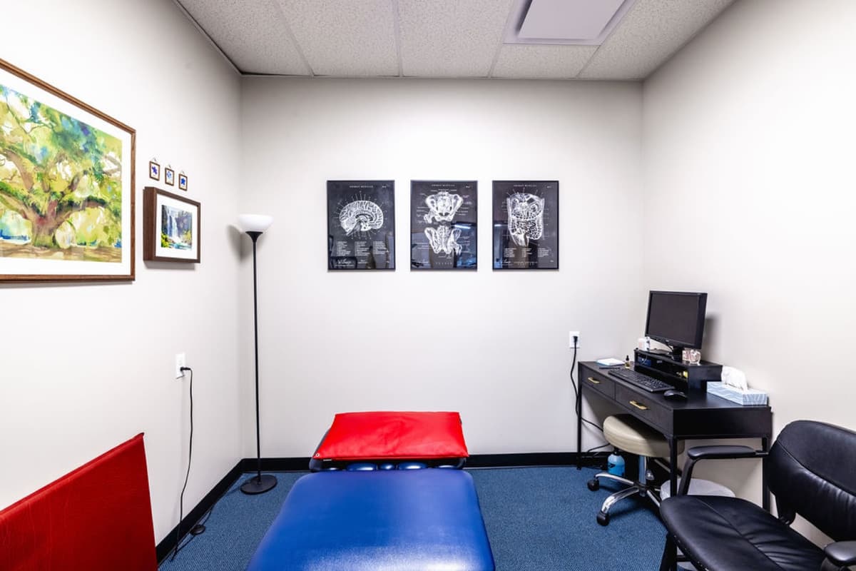 Private treatment room with imaging display wall at FYZICAL Aurora