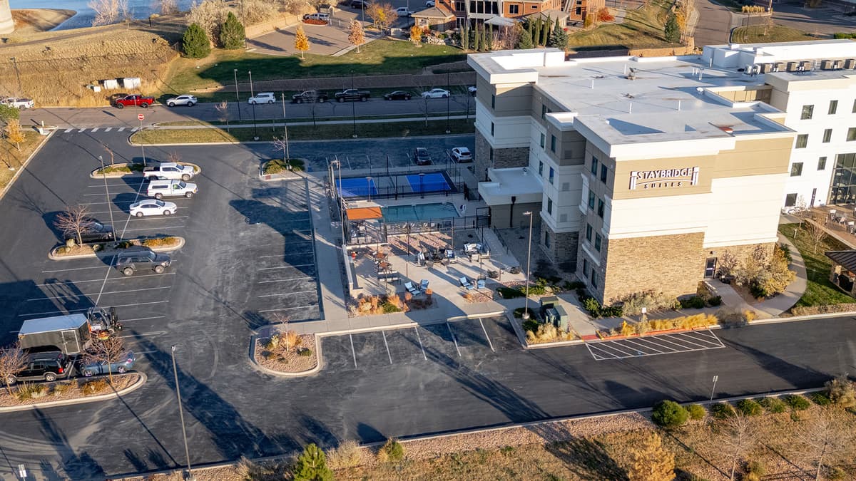 Aerial view of Staybridge Suites construction site during pool installation